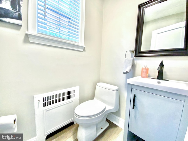 239 Glentay Ave, Lansdowne, PA 19050 - bathroom featuring radiator, toilet, vanity, and wood finished floors