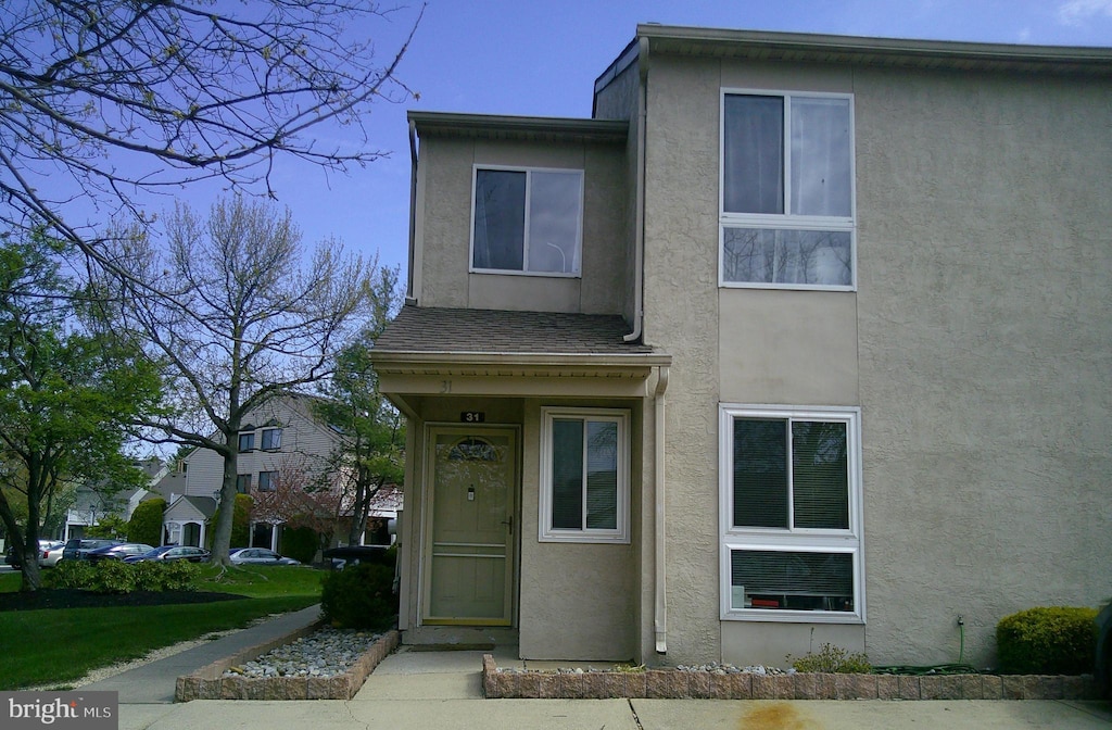view of property with stucco siding