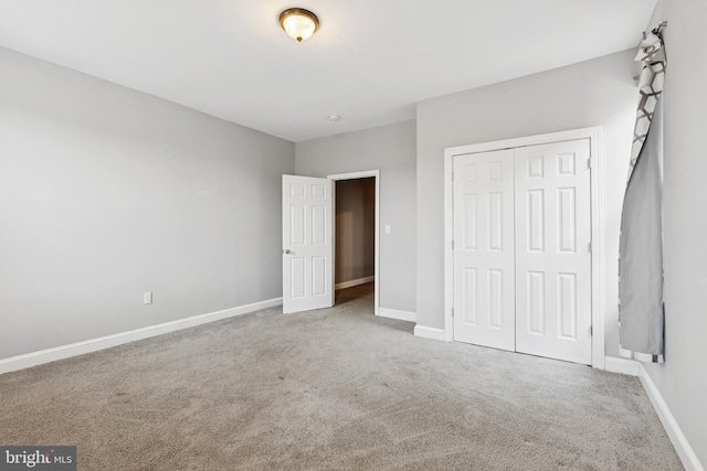 1609 N Hilton St, Baltimore, MD 21216 - unfurnished bedroom featuring carpet floors and a closet