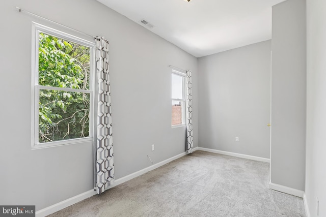 1609 N Hilton St, Baltimore, MD 21216 - unfurnished room featuring healthy amount of natural light and carpet floors