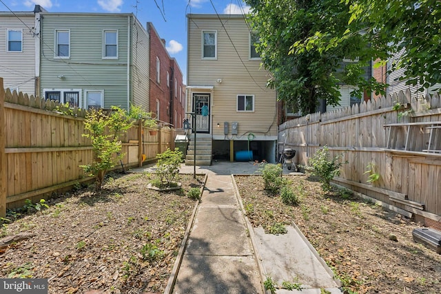 1609 N Hilton St, Baltimore, MD 21216 - back of house with a fenced backyard
