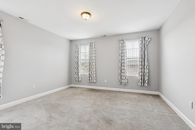 1609 N Hilton St, Baltimore, MD 21216 - spare room with healthy amount of natural light and carpet floors