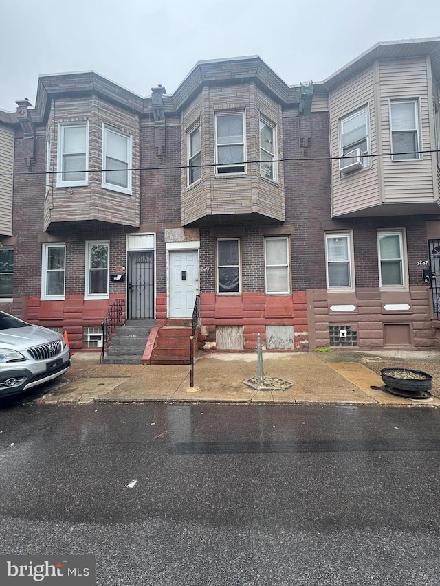 view of property featuring brick siding