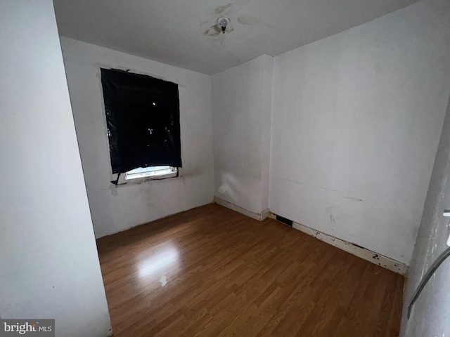 empty room featuring wood finished floors