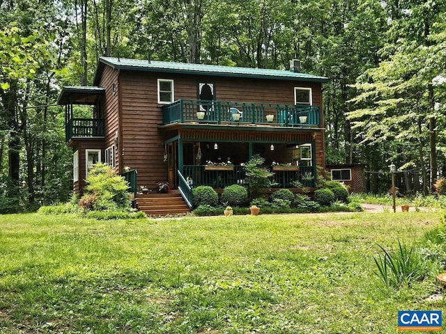 419 Camden St, Dillwyn, VA 23936 - back of property with a balcony, a lawn, a chimney, and a wooden deck