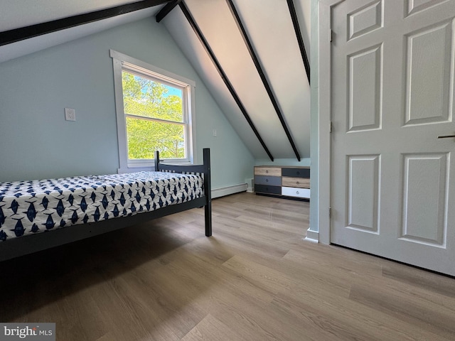 bedroom featuring baseboard heating and light wood-type flooring