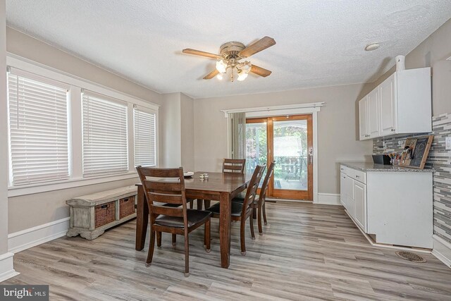 1117 Tatum St, Woodbury, NJ 08096 - dining room with ceiling fan, light wood finished floors, a textured ceiling, and baseboards