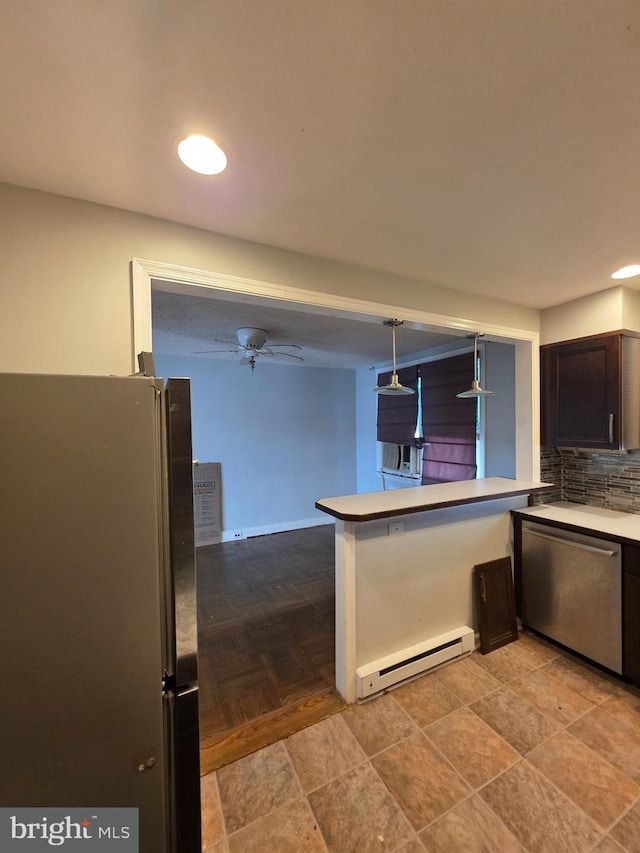 3318 Oakmont St, Philadelphia, PA 19136 - kitchen featuring appliances with stainless steel finishes, a baseboard heating unit, backsplash, a peninsula, and light countertops