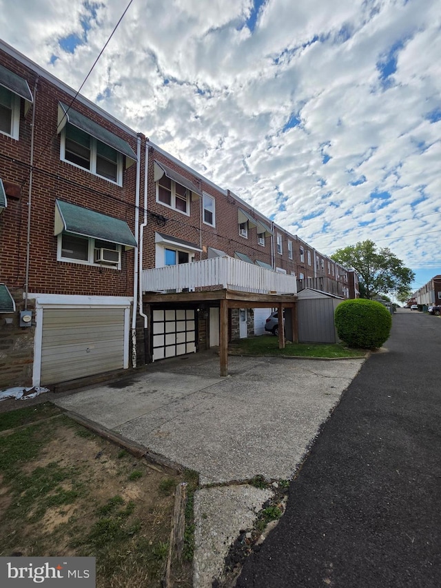 3318 Oakmont St, Philadelphia, PA 19136 - back of property with concrete driveway and an attached garage