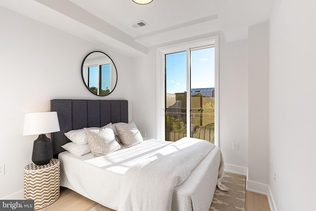 845 19th St NE Unit Ph9, Washington, DC 20002 - bedroom featuring access to exterior, baseboards, and wood finished floors
