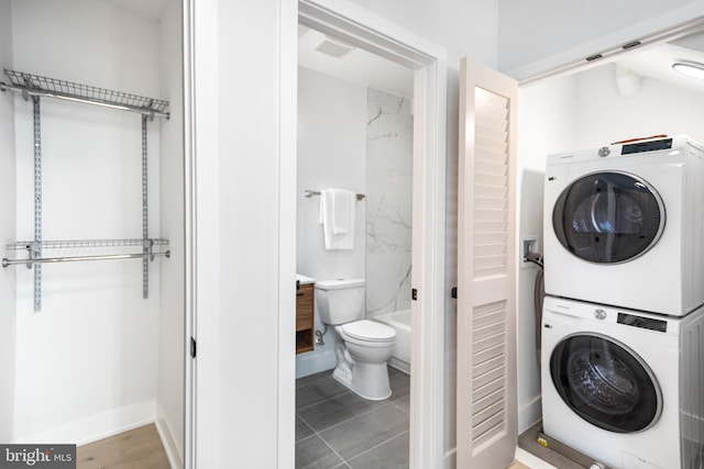 845 19th St NE Unit Ph9, Washington, DC 20002 - laundry area with estacked washer and dryer and baseboards