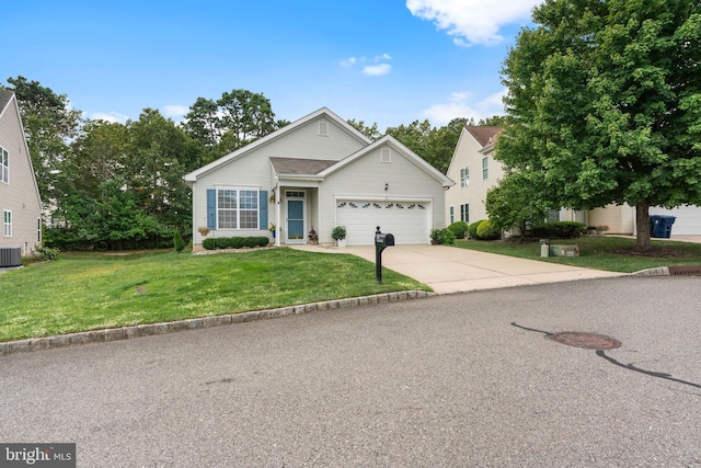 view of front of property featuring an attached garage, concrete driveway, a front lawn, and central air condition unit