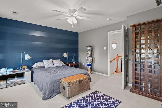 bedroom featuring carpet, baseboards, and a ceiling fan