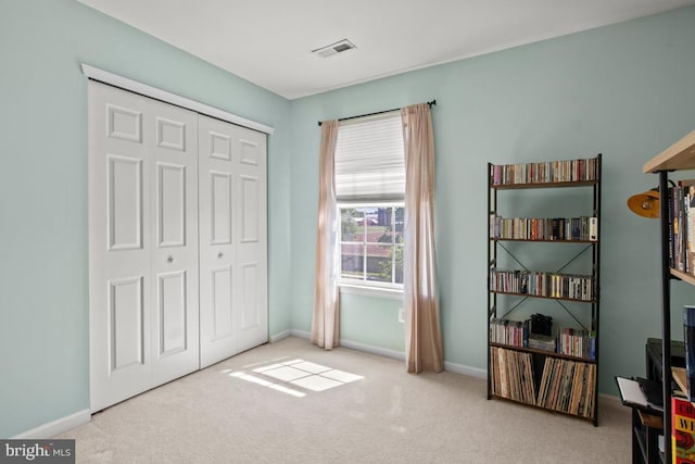 sitting room with carpet flooring and baseboards