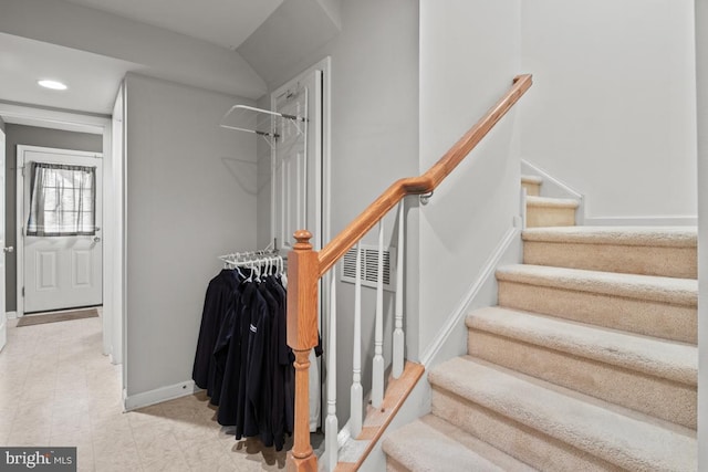 stairway with recessed lighting and baseboards
