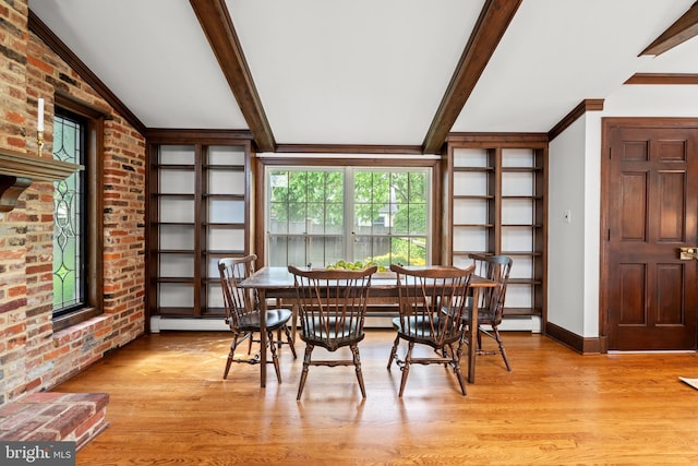 3709 Shepherd St, Chevy Chase, MD 20815 - dining room featuring a baseboard heating unit, light wood finished floors, beamed ceiling, brick wall, and baseboards