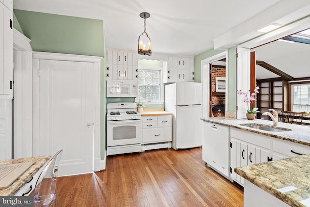 3709 Shepherd St, Chevy Chase, MD 20815 - kitchen with white appliances, a sink, light wood finished floors, and white cabinets