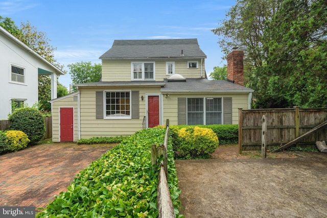 3709 Shepherd St, Chevy Chase, MD 20815 - view of front of home featuring fence, a chimney, and a shingled roof