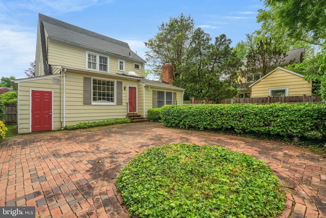 3709 Shepherd St, Chevy Chase, MD 20815 - colonial inspired home with fence, a chimney, and entry steps