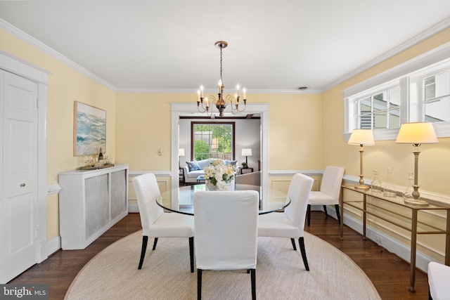3709 Shepherd St, Chevy Chase, MD 20815 - dining space featuring a chandelier, ornamental molding, dark wood finished floors, a wainscoted wall, and a decorative wall