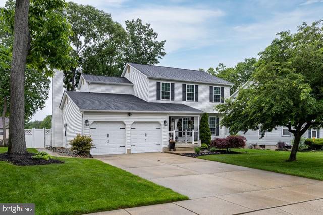 25 Aberdeen Dr, Sicklerville, NJ 08081 - view of front of house featuring a garage, concrete driveway, and a chimney