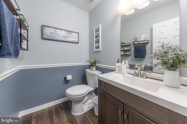 25 Aberdeen Dr, Sicklerville, NJ 08081 - bathroom featuring wood finished floors, toilet, vanity, and baseboards
