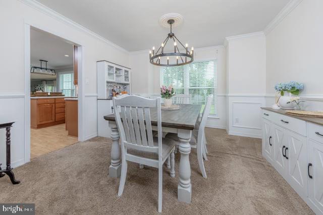 25 Aberdeen Dr, Sicklerville, NJ 08081 - dining room featuring a chandelier, light carpet, ornamental molding, and a wainscoted wall