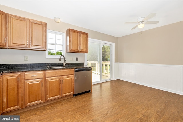11005 Horseshoe Dr, Frederick, MD 21701 - kitchen featuring stainless steel dishwasher, a wainscoted wall, light wood-style floors, a sink, and a ceiling fan
