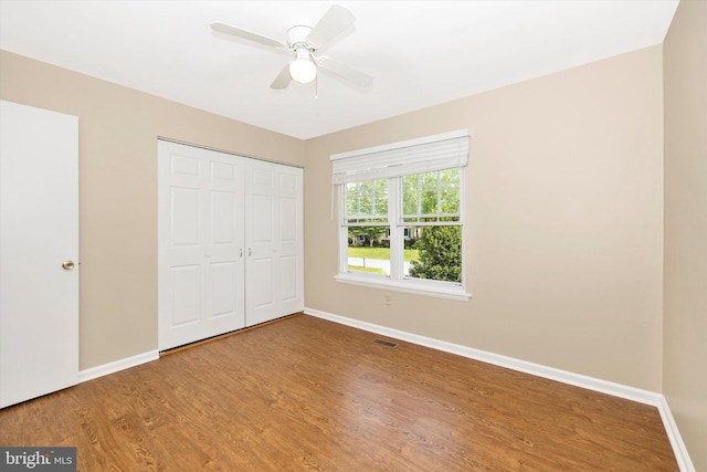 11005 Horseshoe Dr, Frederick, MD 21701 - unfurnished bedroom with baseboards, wood finished floors, a closet, and a ceiling fan