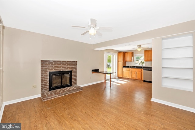 11005 Horseshoe Dr, Frederick, MD 21701 - unfurnished living room with a ceiling fan, light wood-style flooring, and baseboards