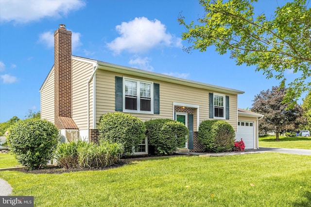 11005 Horseshoe Dr, Frederick, MD 21701 - bi-level home with a chimney, a front lawn, a garage, and driveway