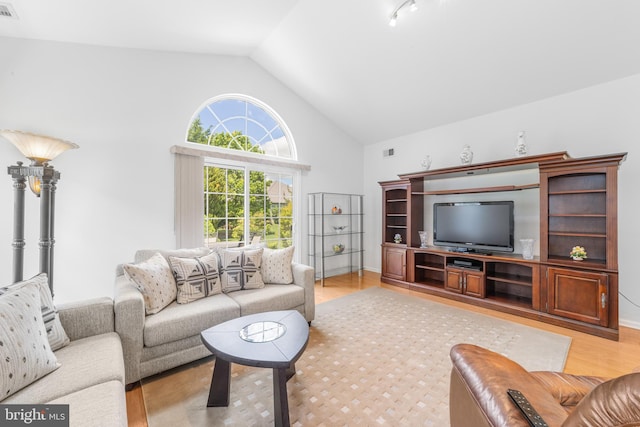 17 San Marco, West Windsor, NJ 08550 - living area with light wood-style floors, high vaulted ceiling, and baseboards