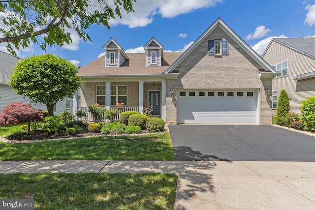 17 San Marco, West Windsor, NJ 08550 - view of front facade with brick siding, covered porch, driveway, and a front lawn