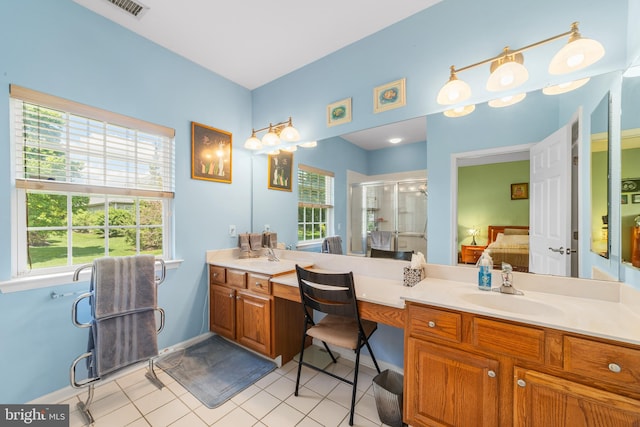 17 San Marco, West Windsor, NJ 08550 - ensuite bathroom featuring a stall shower, healthy amount of natural light, double vanity, and tile patterned floors