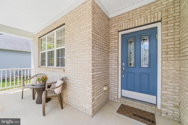 17 San Marco, West Windsor, NJ 08550 - doorway to property featuring a porch and brick siding