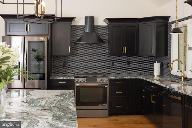 28 Stillwater Ct, Ridgeley, WV 26753 - kitchen with stainless steel appliances, wall chimney range hood, a sink, light stone counters, and a chandelier