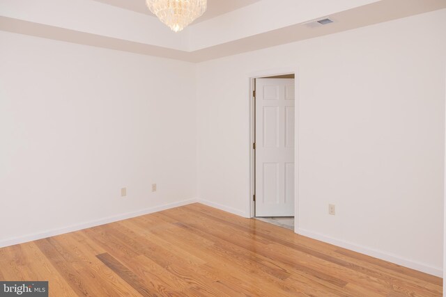 28 Stillwater Ct, Ridgeley, WV 26753 - unfurnished room featuring light wood-style flooring, baseboards, and a chandelier