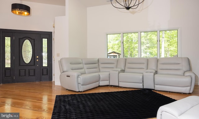 28 Stillwater Ct, Ridgeley, WV 26753 - living area with light wood-style flooring, a towering ceiling, and a chandelier