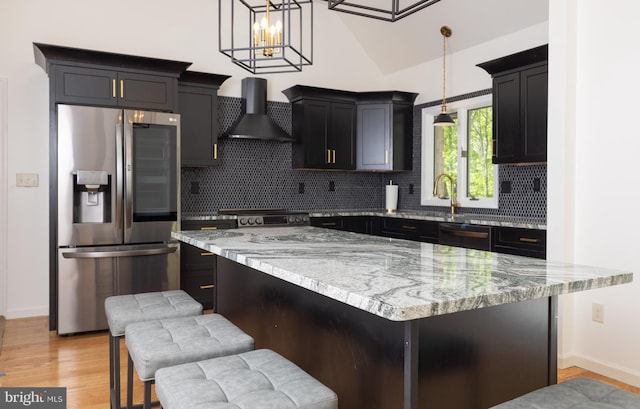 28 Stillwater Ct, Ridgeley, WV 26753 - kitchen with stainless steel appliances, wall chimney range hood, decorative backsplash, and light stone countertops