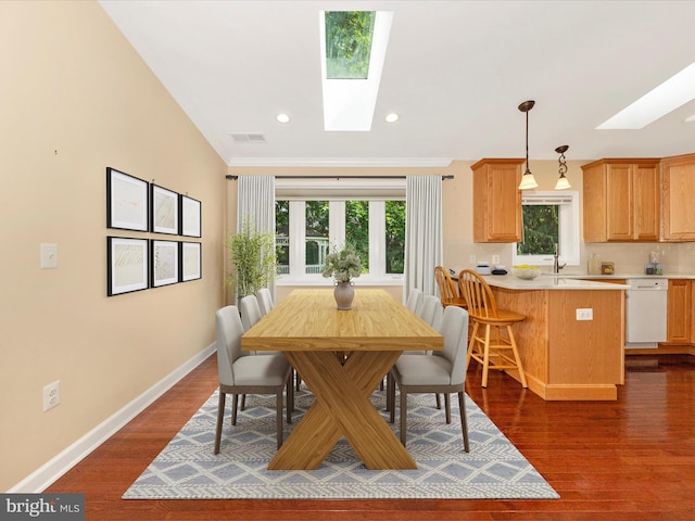22028 Beaverbrook Dr, Smithsburg, MD 21783 - dining room featuring a skylight, baseboards, ornamental molding, dark wood-style floors, and recessed lighting