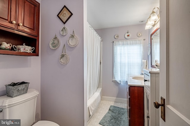 bathroom with toilet, vanity, shower / bathtub combination with curtain, and baseboards