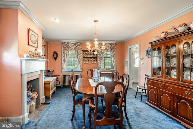 carpeted dining space with a chandelier, ornamental molding, radiator, a fireplace with flush hearth, and baseboards