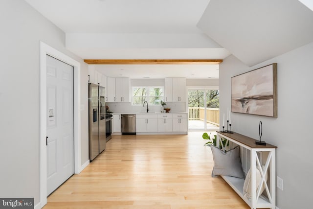 901 E Quaker Bottom Rd, Sparks Glencoe, MD 21152 - kitchen featuring appliances with stainless steel finishes, light wood-style floors, a sink, white cabinetry, and light countertops