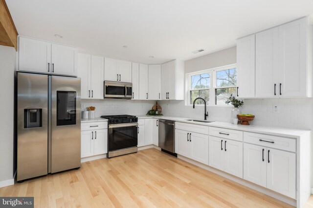 901 E Quaker Bottom Rd, Sparks Glencoe, MD 21152 - kitchen with appliances with stainless steel finishes, a sink, backsplash, and light countertops