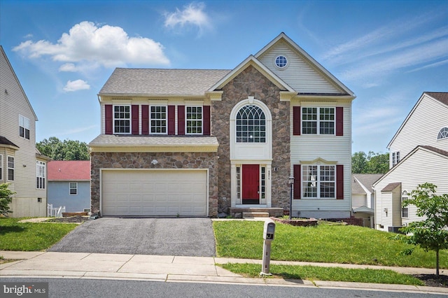 6624 Aaron Mee Way, Baltimore, MD 21237 - view of front of property with stone siding, driveway, a garage, and a front lawn