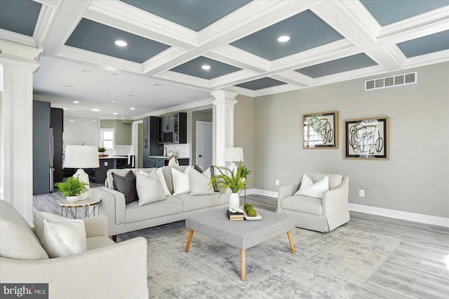 6624 Aaron Mee Way, Baltimore, MD 21237 - living room featuring ornate columns, coffered ceiling, light wood finished floors, beamed ceiling, and ornamental molding