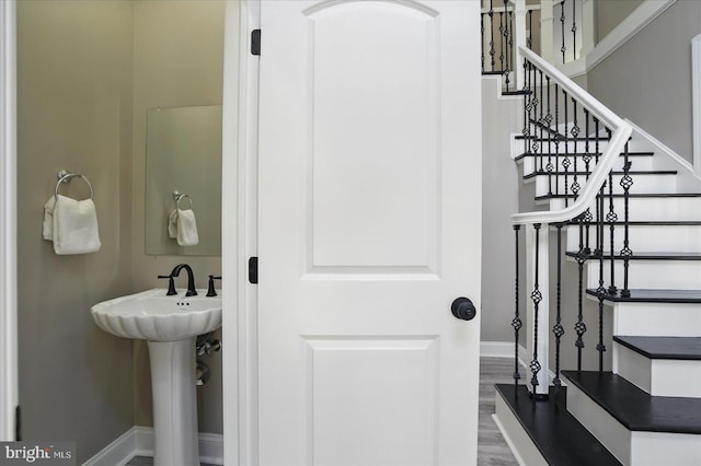 6624 Aaron Mee Way, Baltimore, MD 21237 - staircase with baseboards and wood finished floors