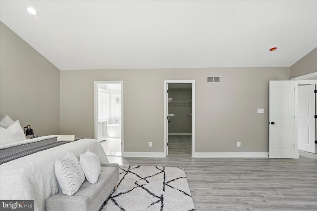 6624 Aaron Mee Way, Baltimore, MD 21237 - bedroom featuring light wood-style floors, baseboards, a walk in closet, recessed lighting, and a closet