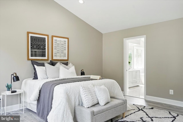 6624 Aaron Mee Way, Baltimore, MD 21237 - bedroom with wood finished floors, baseboards, vaulted ceiling, connected bathroom, and recessed lighting