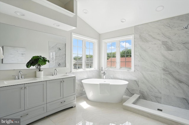 6624 Aaron Mee Way, Baltimore, MD 21237 - bathroom with tile walls, a tile shower, double vanity, lofted ceiling, and a freestanding tub